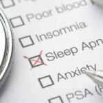 A list of health conditions next to squares, with Sleep Apnea marked with a red X